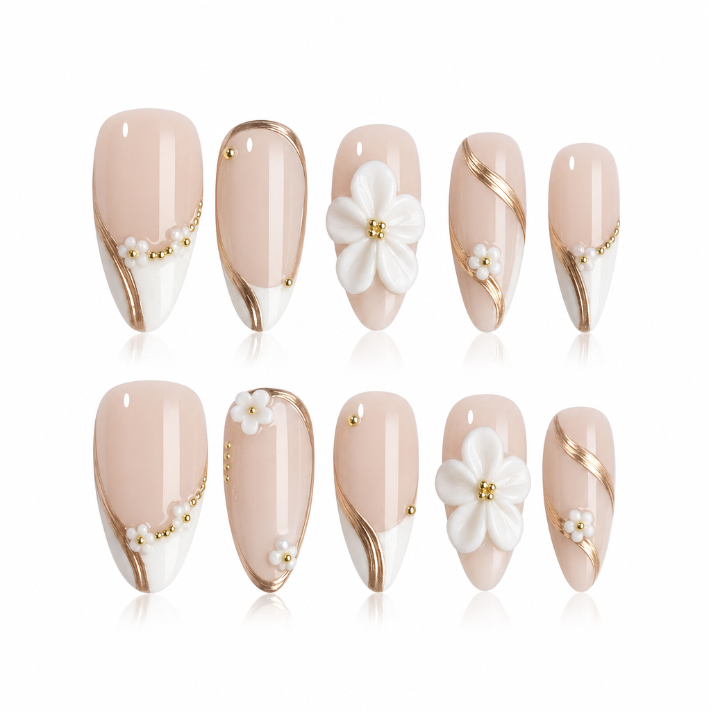 Set of decorative nails with floral and gold accent designs on a white background
