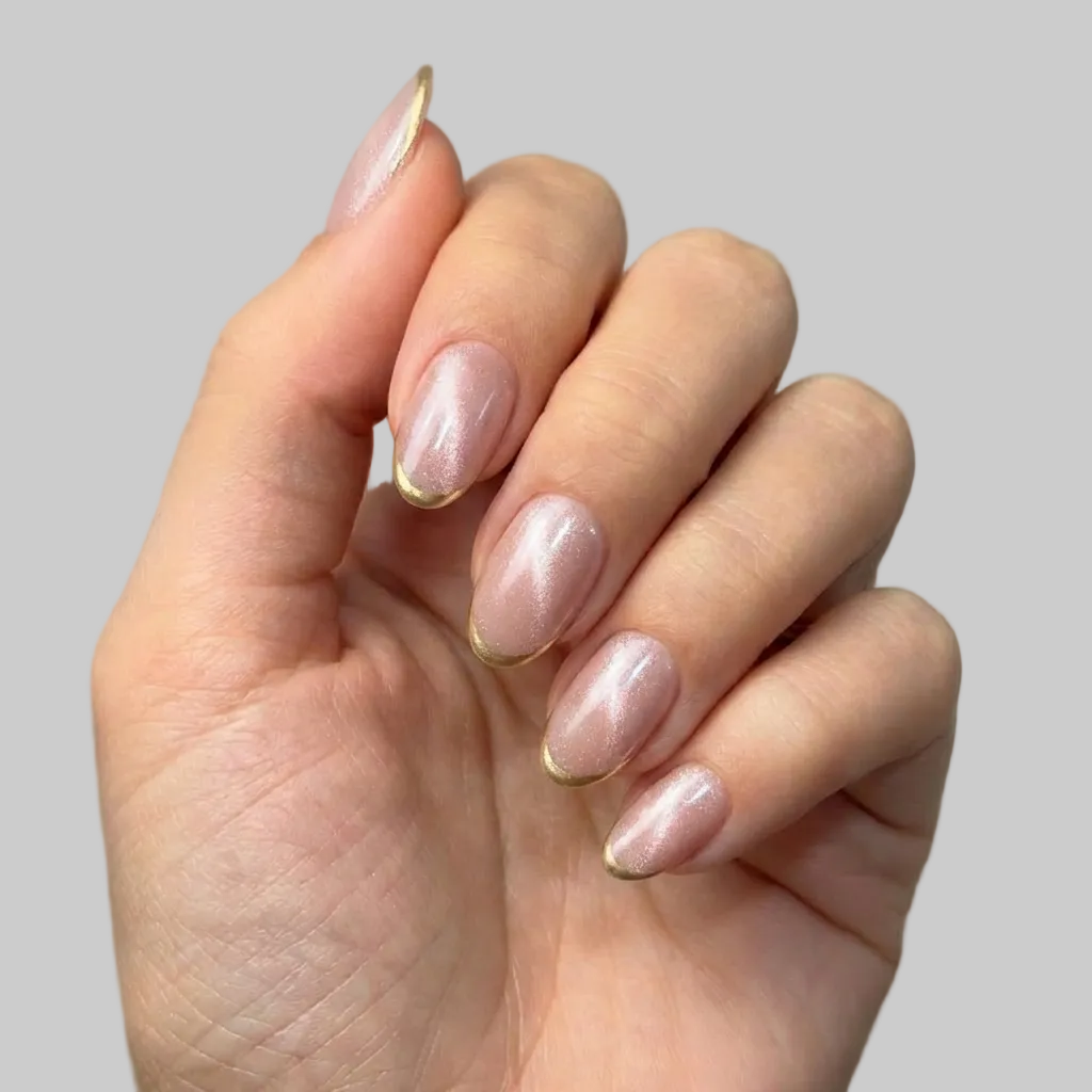 Hand with pink nail polish on a neutral background